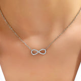 White gold necklace with infinity pendant and zirconia.