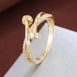 Crossed white gold ring with zirconias