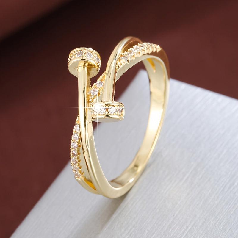 Crossed white gold ring with zirconias