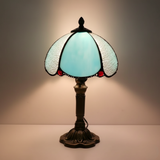 Lampe mit blauem Glasgehäuse