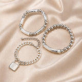Collection of Bracelets with White Gold Beads and Punk Style Clasp