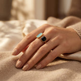 Open gold ring with two stones