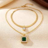 Layered gold and emerald necklace