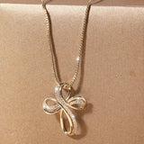 White gold necklace with intertwined cross pendant