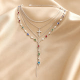 White gold necklace and earring set with multicoloured stones
