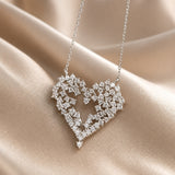 White gold pendant necklace with zirconium heart