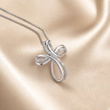 White gold necklace with intertwined cross pendant