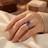 Silver ring with amethyst and side stones