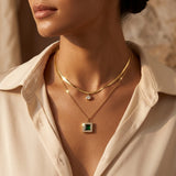 Layered gold and emerald necklace