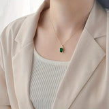 Rectangular Halo Necklace in Gold and Emerald