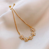 White Gold Bracelet with Flower-Shaped Zircons