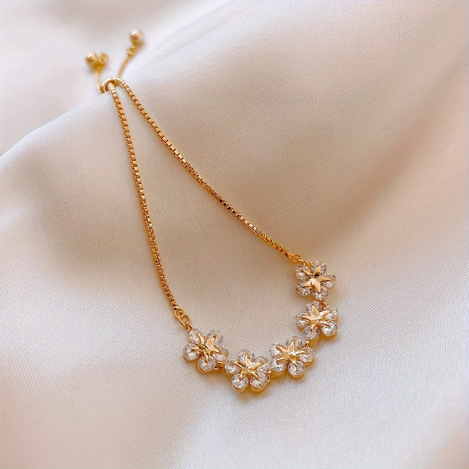 White Gold Bracelet with Flower-Shaped Zircons