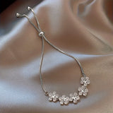 White Gold Bracelet with Flower-Shaped Zircons