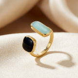 Open gold ring with two stones